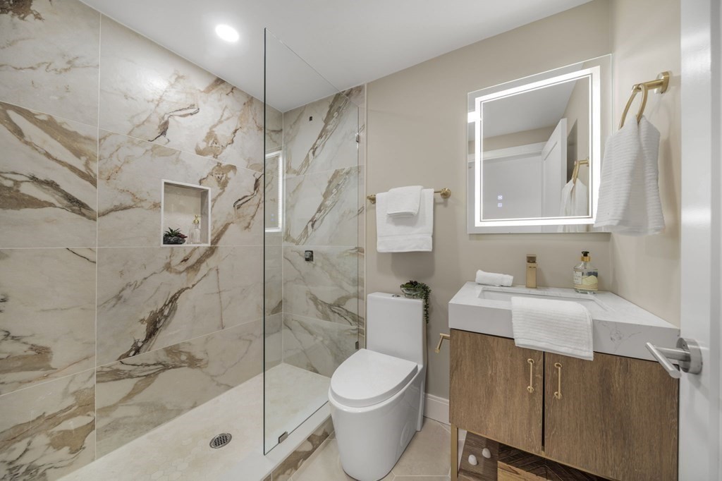 340 Meridian Street, Unit 1 Boston, MA 02128 - Photo 13 of 24 a bathroom with a sink toilet and shower