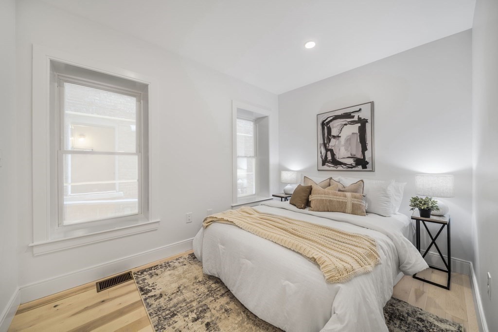 340 Meridian Street, Unit 1 Boston, MA 02128 - Photo 20 of 24 a bedroom with a bed and a window