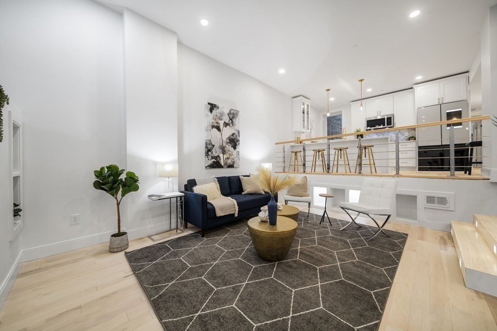 340 Meridian Street, Unit 1 Boston, MA 02128 - Photo 2 of 24 a living room with furniture a potted plant and a table