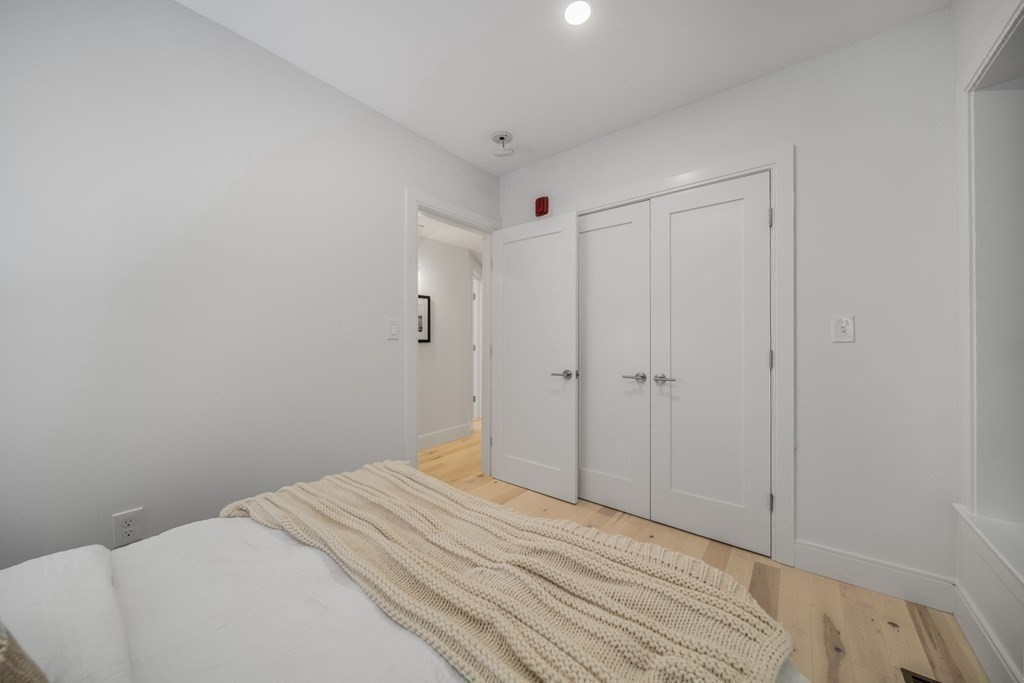 340 Meridian Street, Unit 1 Boston, MA 02128 - Photo 21 of 24 a bedroom with a bed and a bathroom