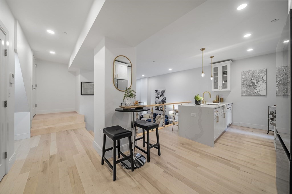 340 Meridian Street, Unit 1 Boston, MA 02128 - Photo 4 of 24 a living room with furniture and a wooden floor