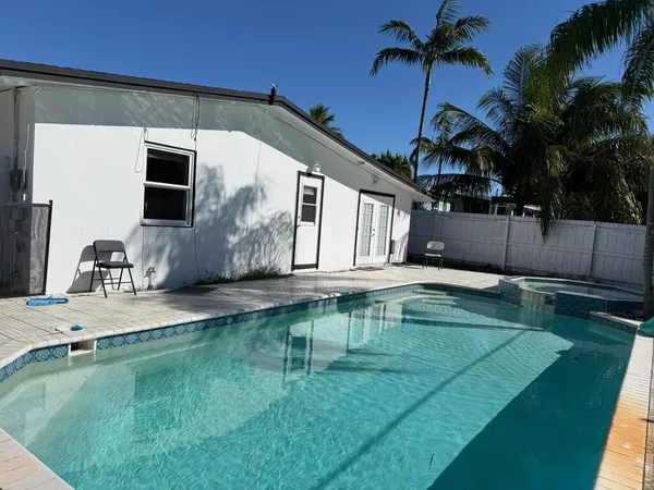 a house view with a swimming pool