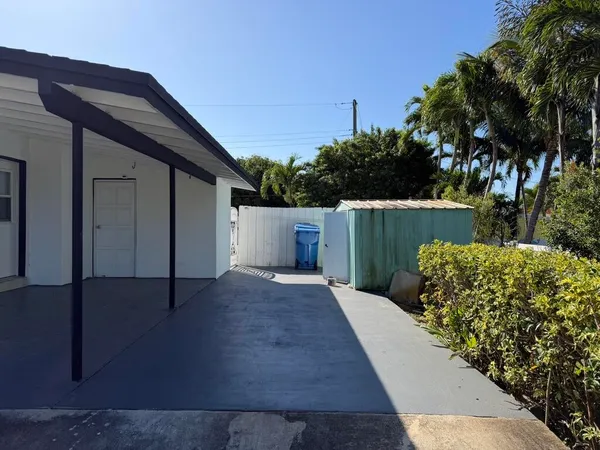 a view of a house with a small yard