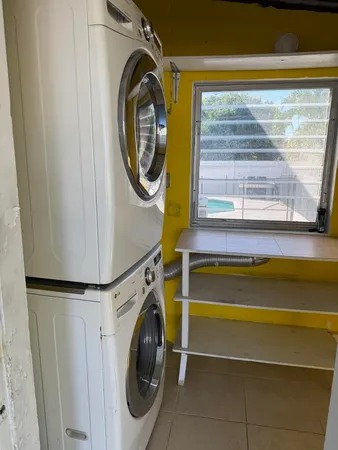 a utility room with dryer and washer