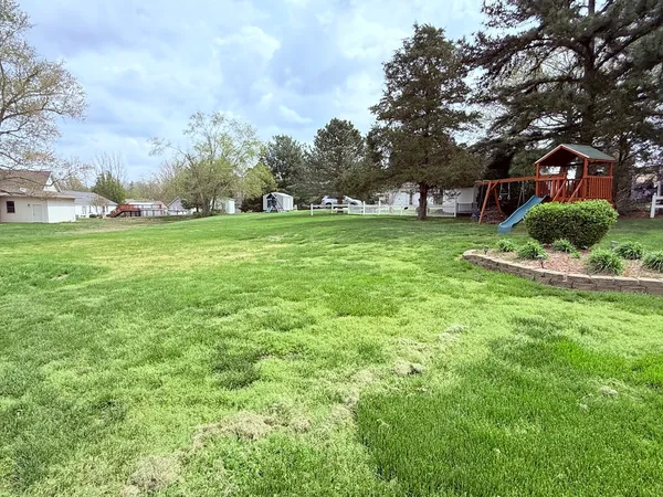 a view of a house with a big yard