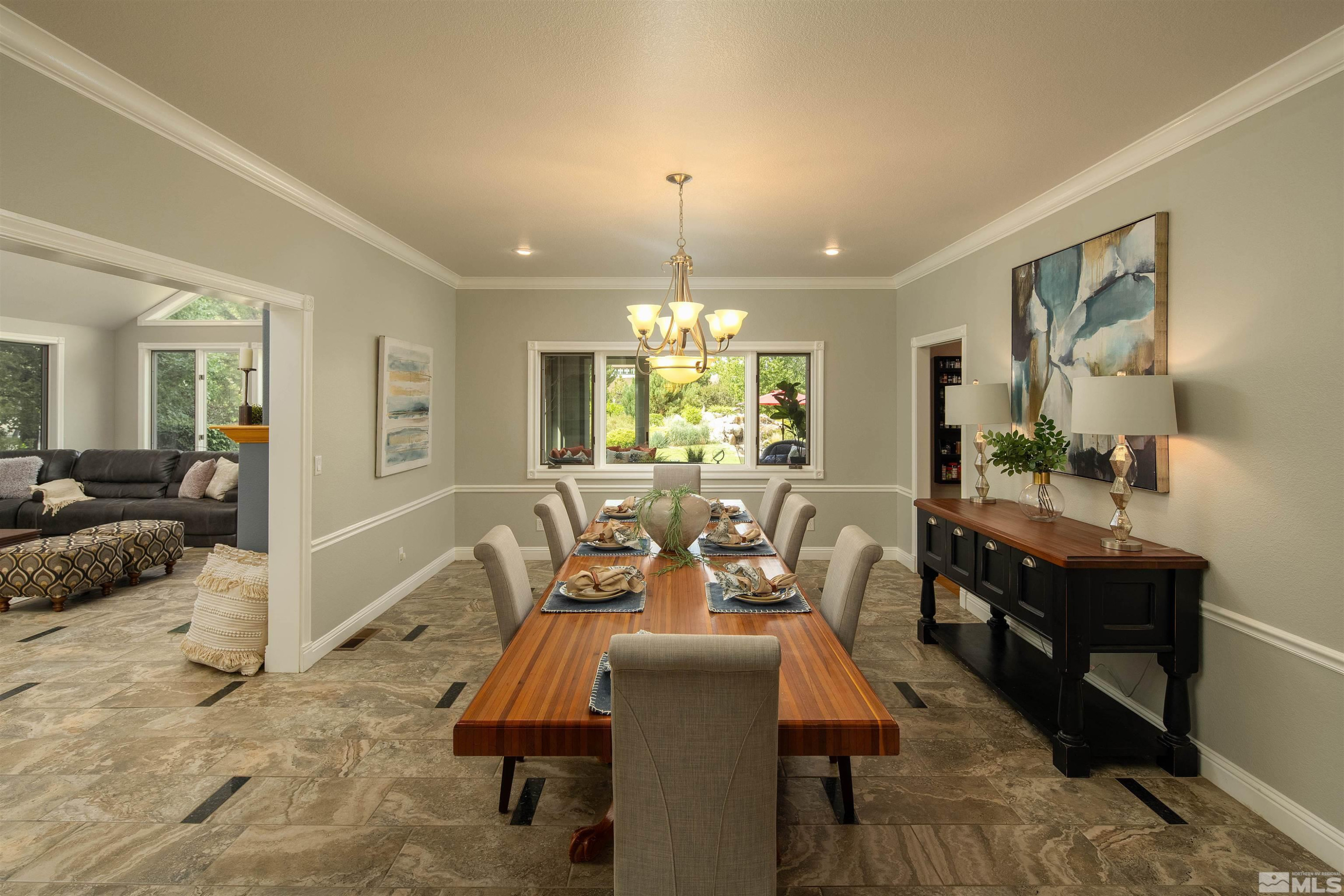 2032 Ash Canyon Road Carson City, NV 89703 - Photo 11 of 37 a view of a dining room with furniture window and wooden floor