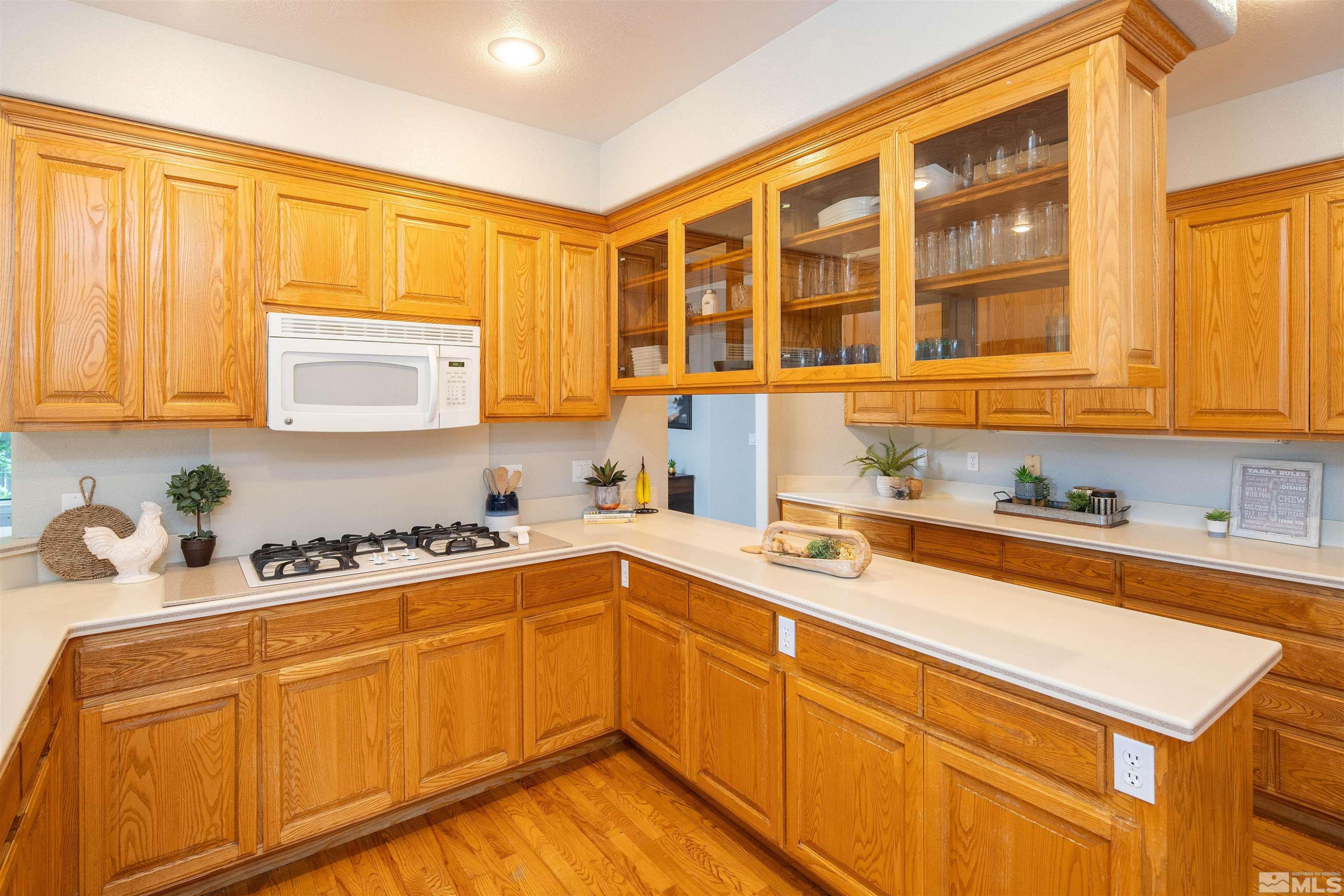 2032 Ash Canyon Road Carson City, NV 89703 - Photo 15 of 37 a kitchen with stainless steel appliances granite countertop a sink stove and cabinets