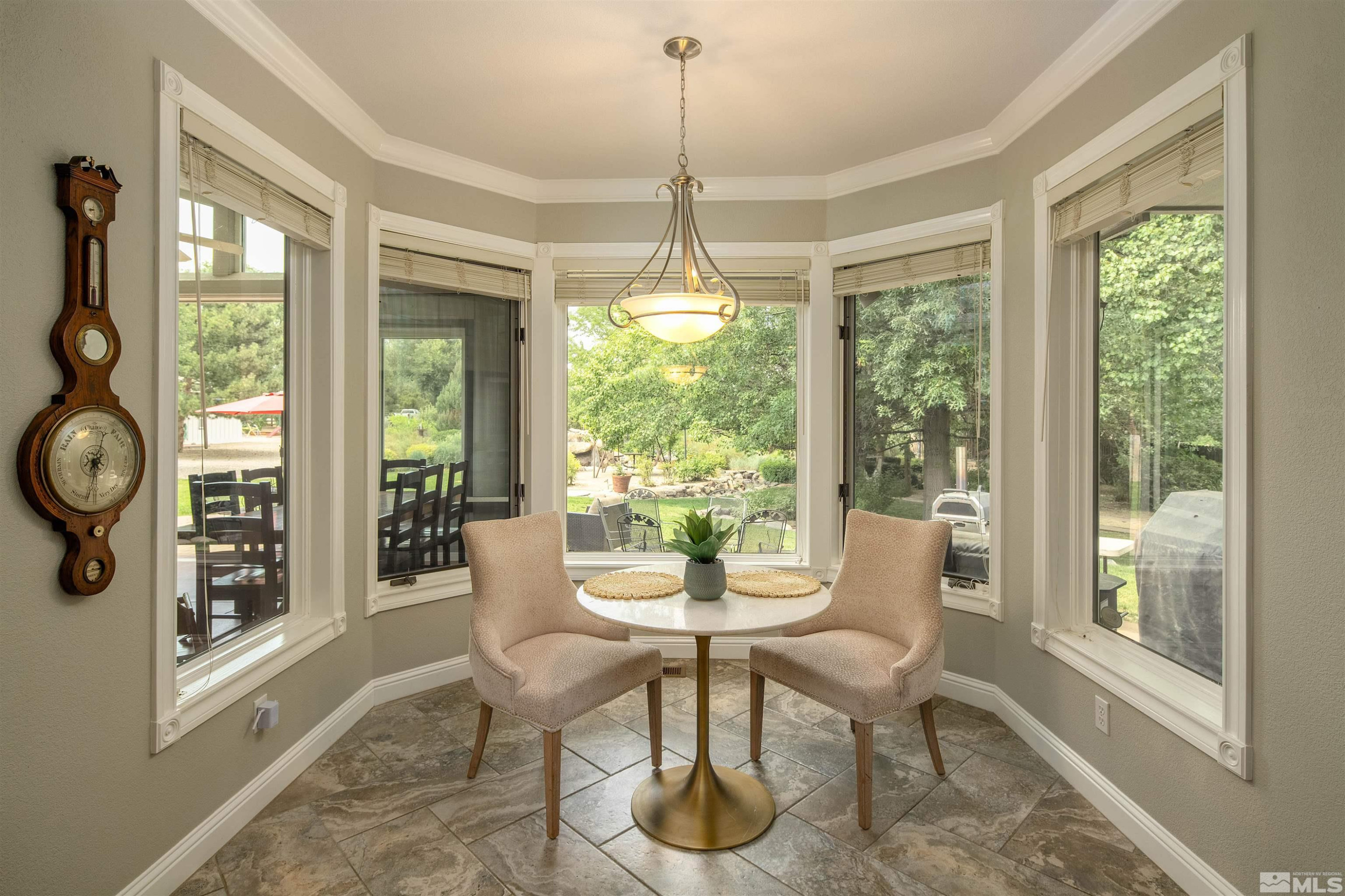 2032 Ash Canyon Road Carson City, NV 89703 - Photo 18 of 37 a dining room with furniture front door and wooden floor
