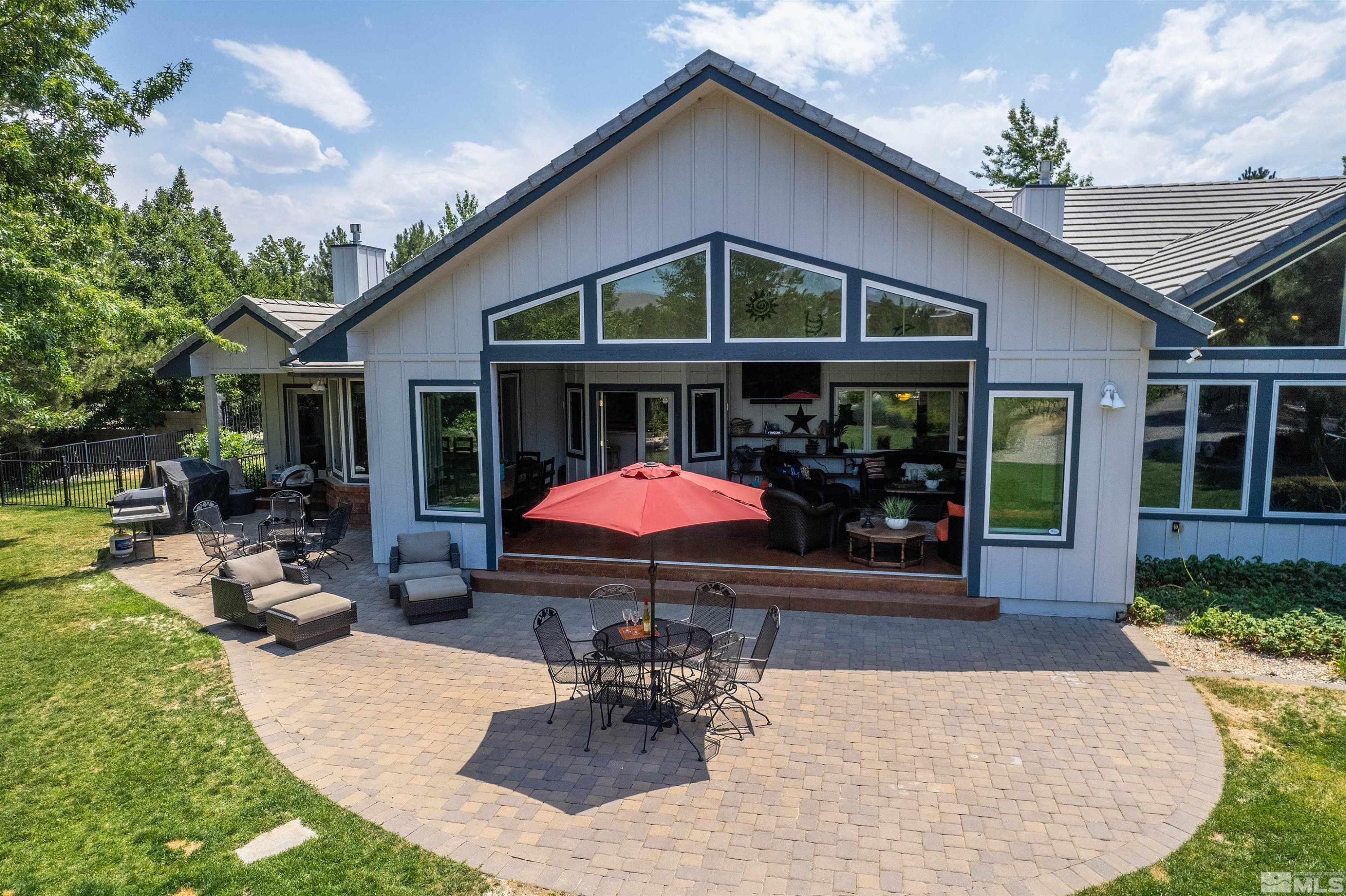 2032 Ash Canyon Road Carson City, NV 89703 - Photo 23 of 37 a view of a house with backyard porch and sitting area