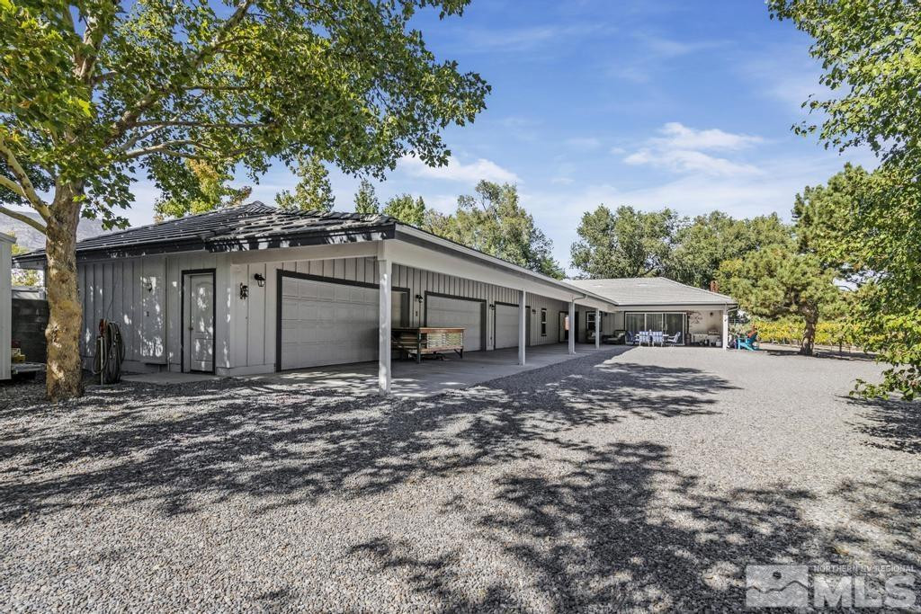 2032 Ash Canyon Road Carson City, NV 89703 - Photo 30 of 37 a front view of a house with a garden