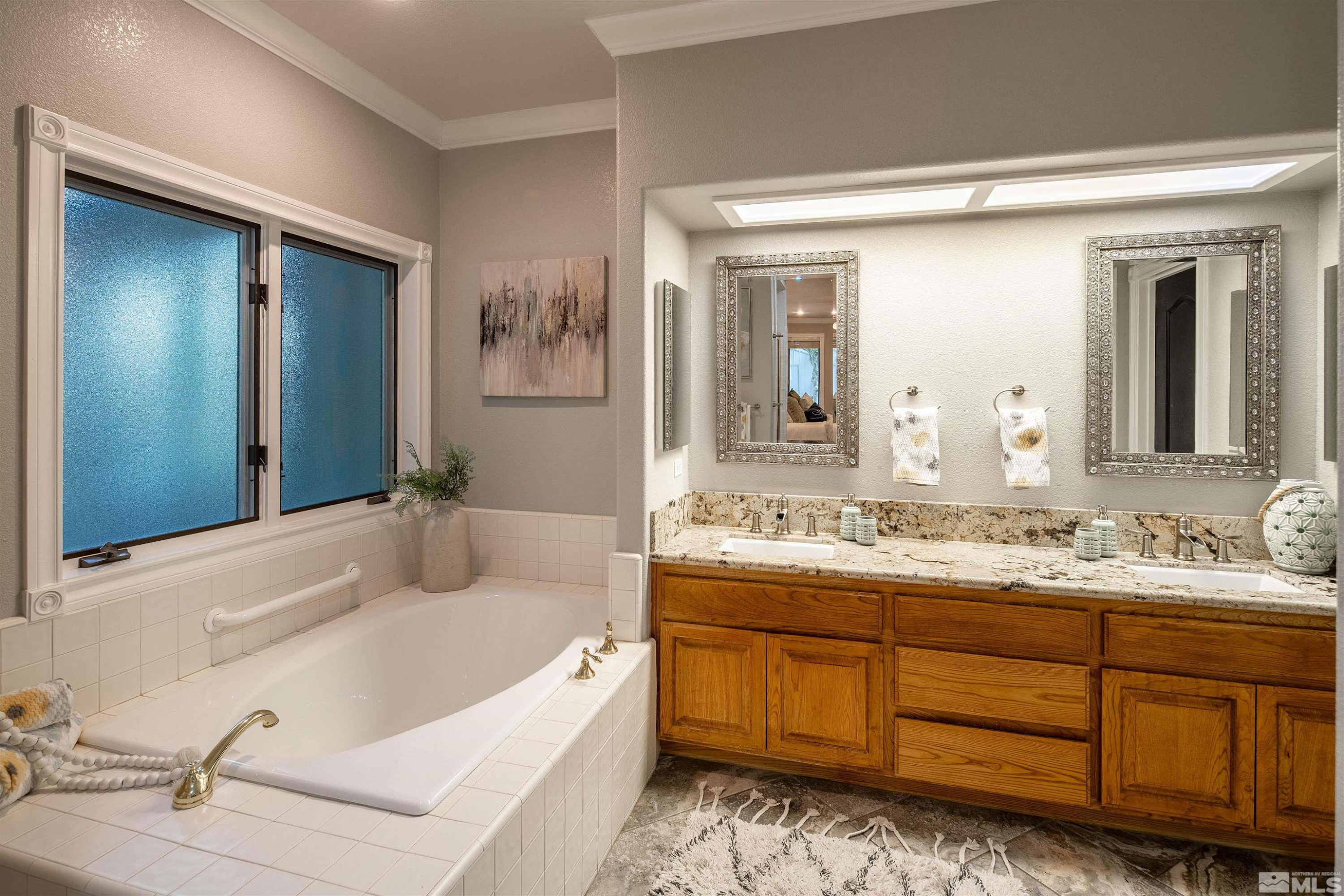 2032 Ash Canyon Road Carson City, NV 89703 - Photo 9 of 37 a bathroom with a tub sink and mirror