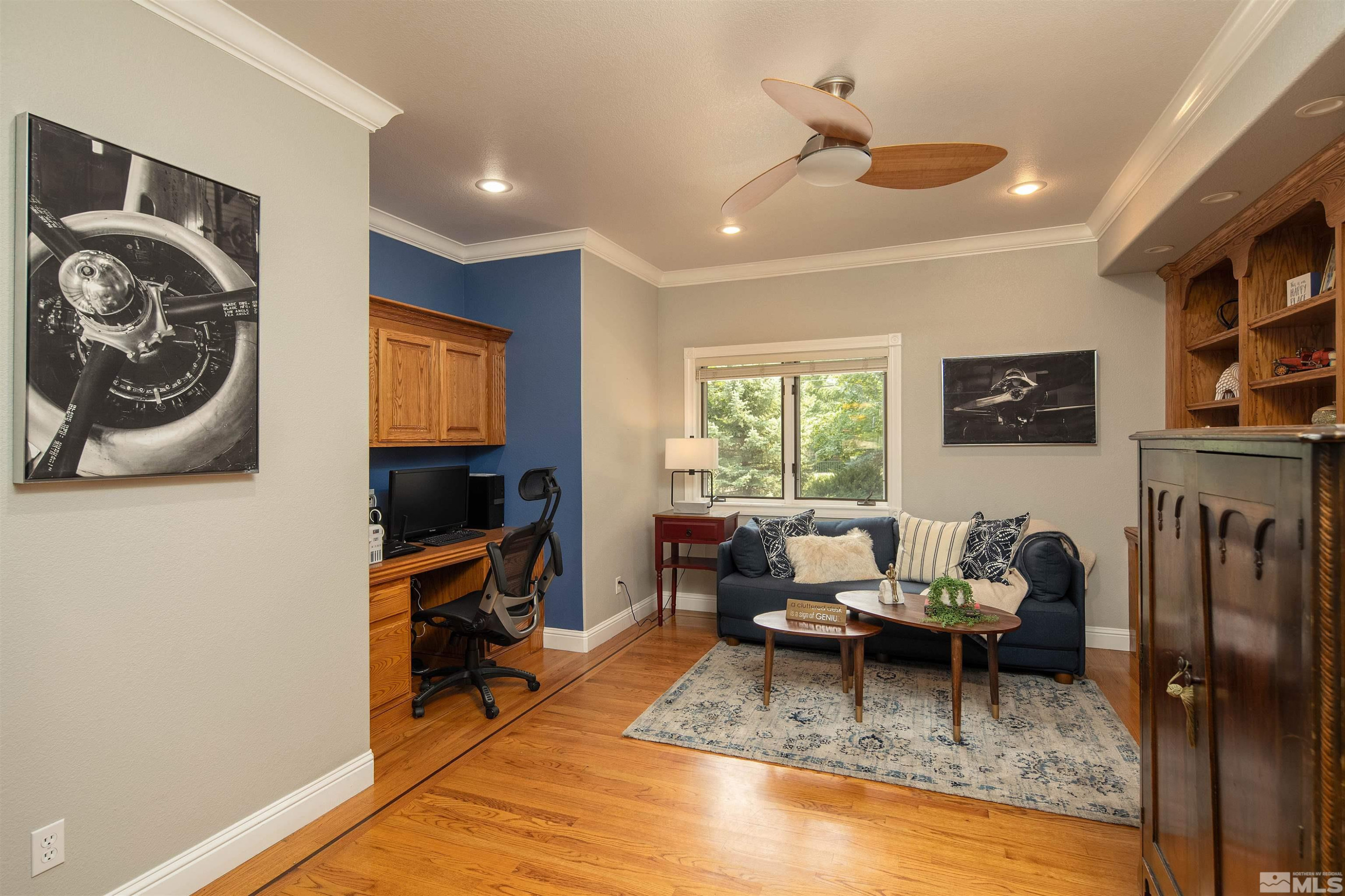 2032 Ash Canyon Road Carson City, NV 89703 - Photo 10 of 37 a living room with furniture a window and a flat screen tv
