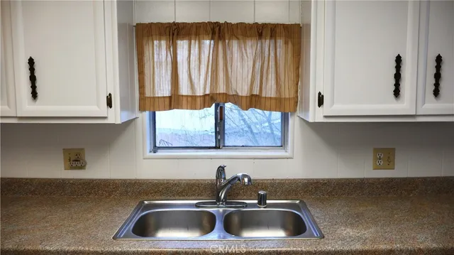 a bathroom with a sink and a window