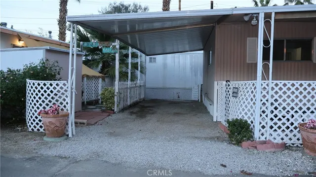 a view of a patio with table and chairs