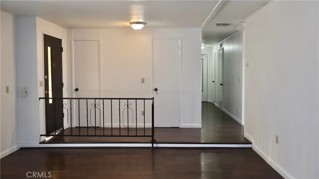 a view of entryway with wooden floor