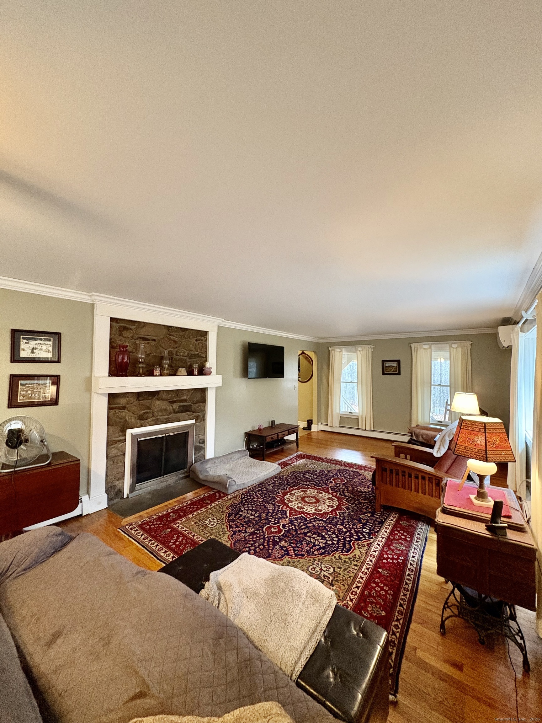 208 Old Forge Road Hartland, CT 06065 - Photo 15 of 36 a bedroom with furniture fireplace and window