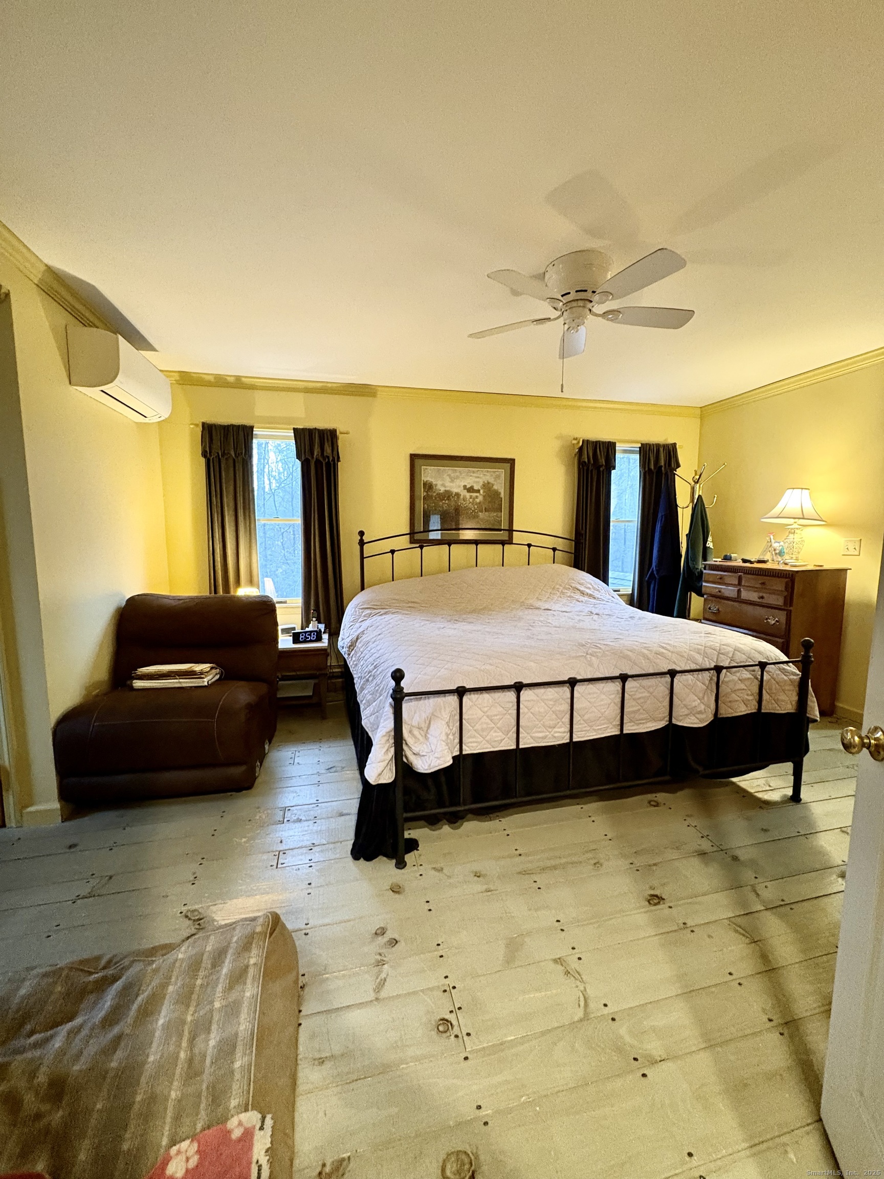 208 Old Forge Road Hartland, CT 06065 - Photo 23 of 36 a bedroom with a bed and wooden floor