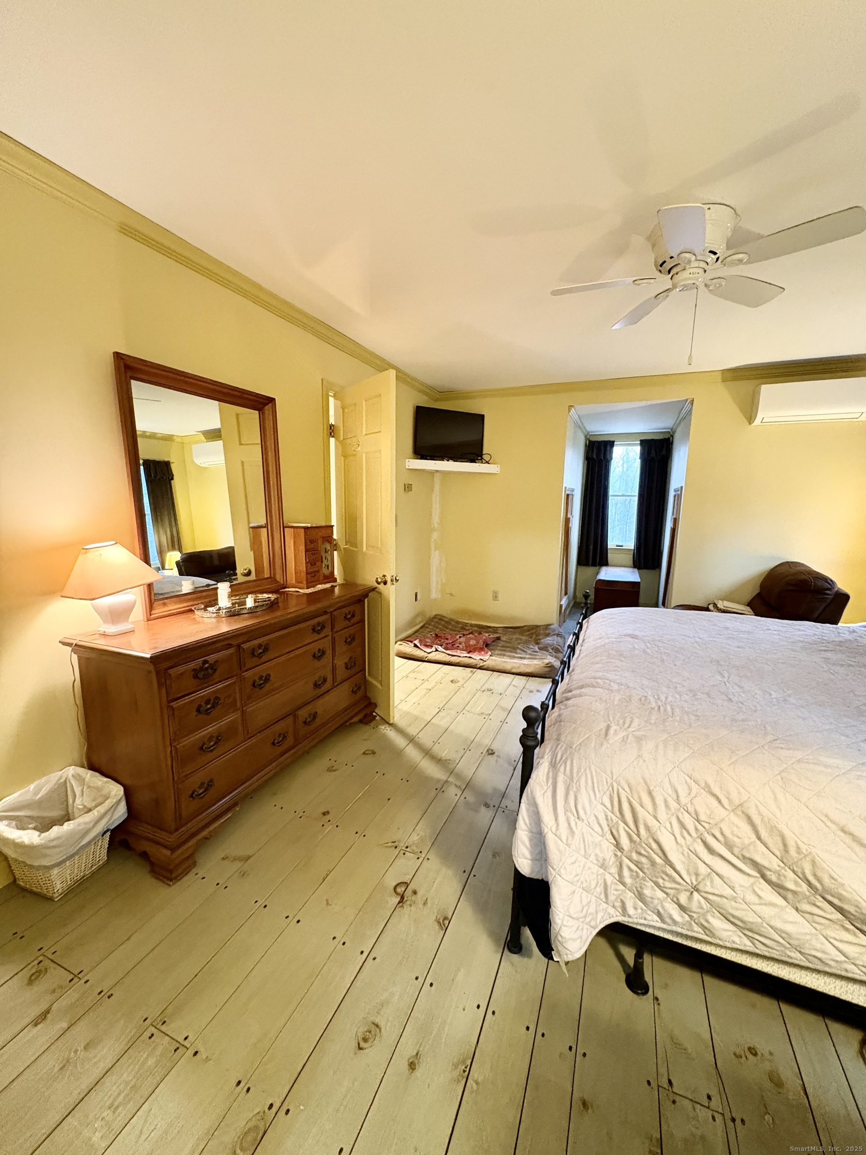 208 Old Forge Road Hartland, CT 06065 - Photo 25 of 36 a bedroom with a bed and wooden floor