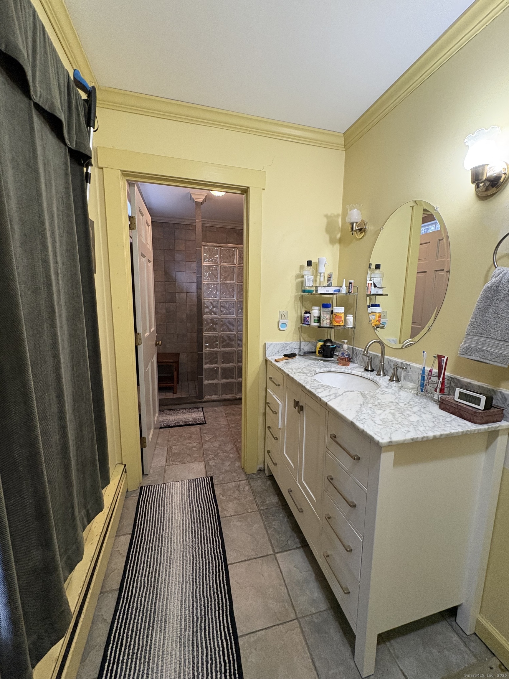 208 Old Forge Road Hartland, CT 06065 - Photo 26 of 36 a bathroom with a granite countertop sink a mirror and shower