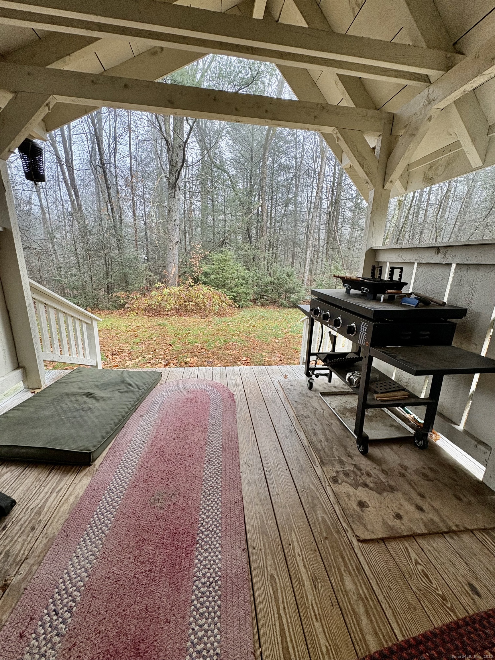 208 Old Forge Road Hartland, CT 06065 - Photo 30 of 36 a bedroom with a bed and a table