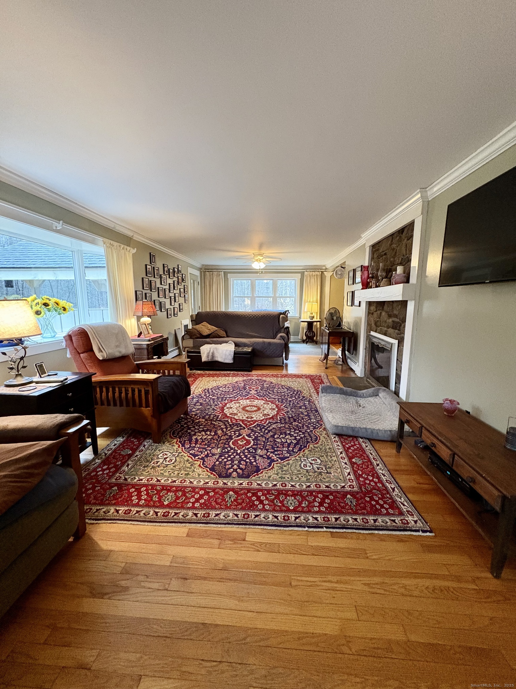 208 Old Forge Road Hartland, CT 06065 - Photo 4 of 36 a living room with furniture and a flat screen tv
