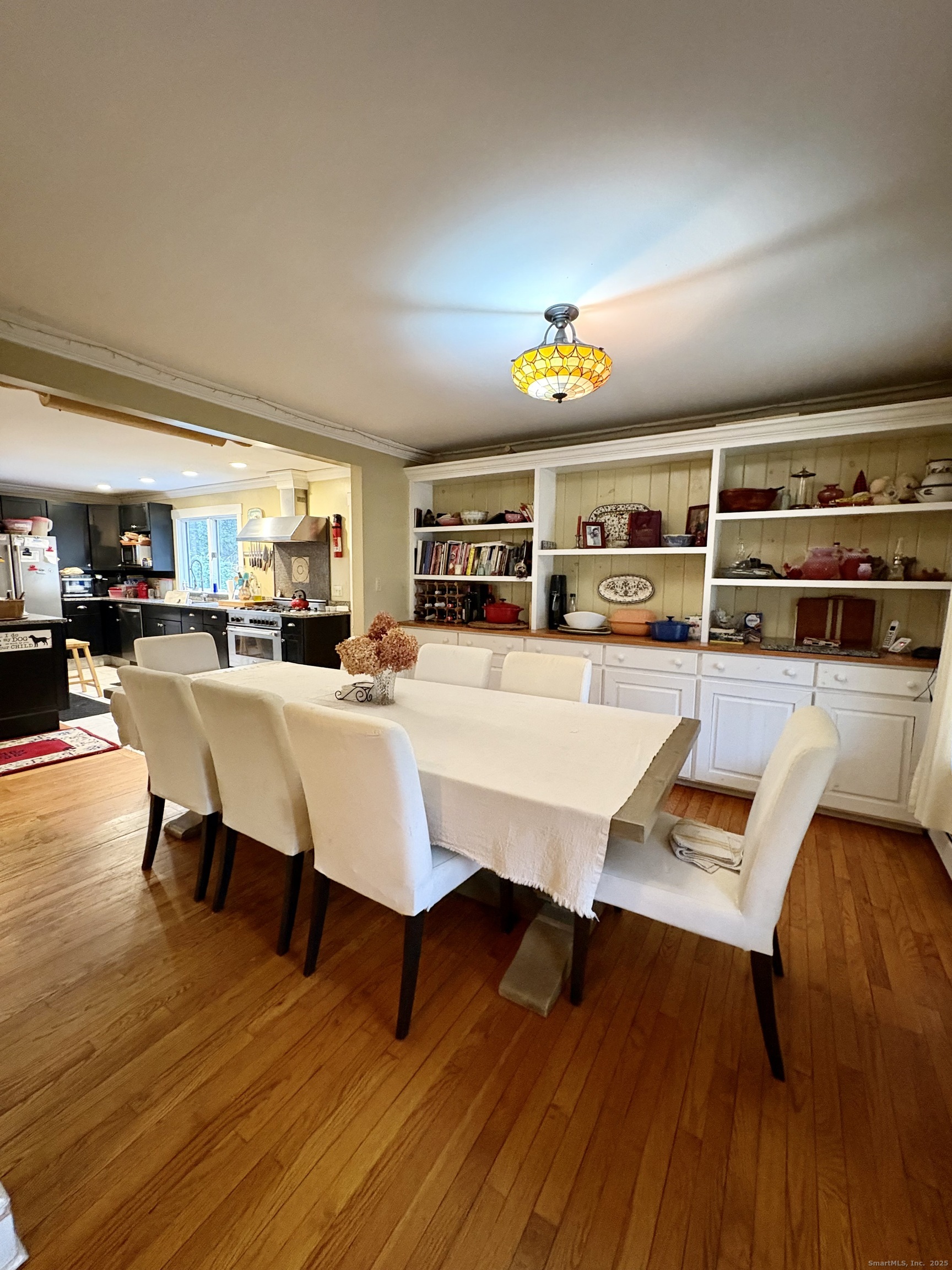 208 Old Forge Road Hartland, CT 06065 - Photo 6 of 36 a living room with furniture a rug and a floor to ceiling window