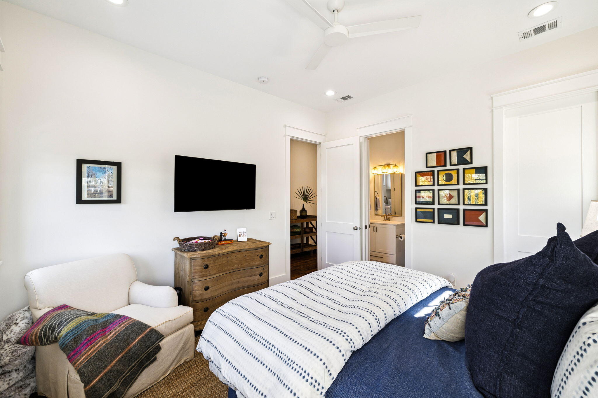 93 Eastern Lake Court Santa Rosa Beach, FL 32459 - Photo 12 of 56 a bedroom with a bed and a flat screen tv