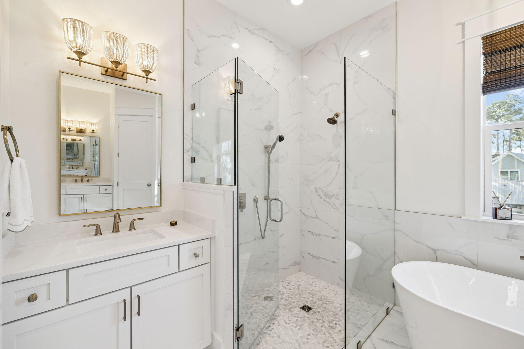 93 Eastern Lake Court Santa Rosa Beach, FL 32459 - Photo 16 of 56 a bathroom with a shower sink vanity and mirror