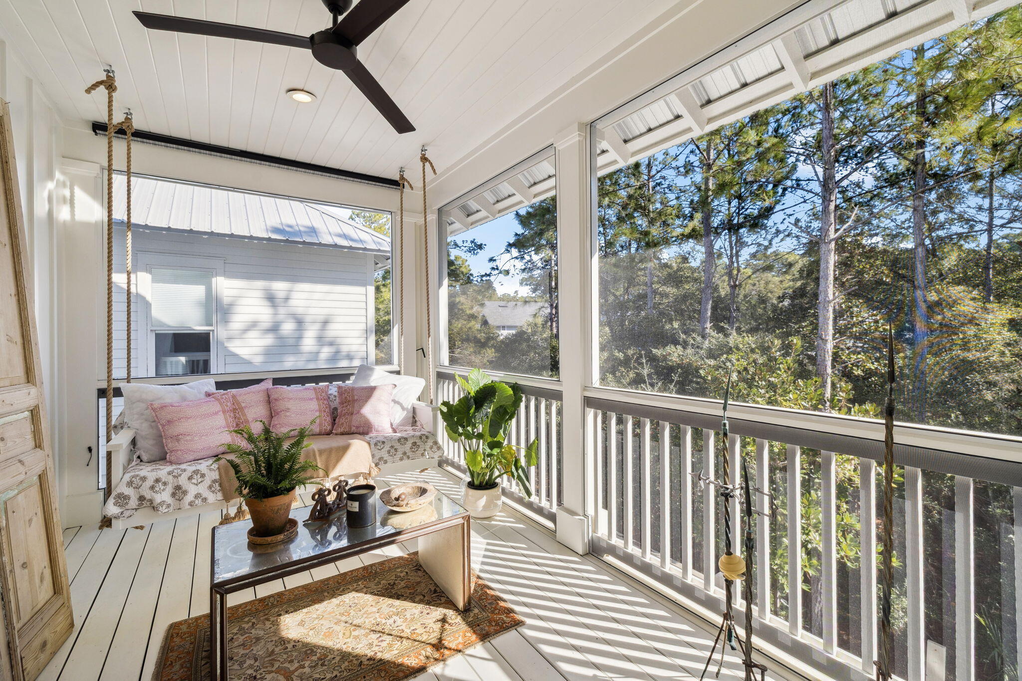 93 Eastern Lake Court Santa Rosa Beach, FL 32459 - Photo 18 of 56 a view of a porch with furniture and floor to ceiling window