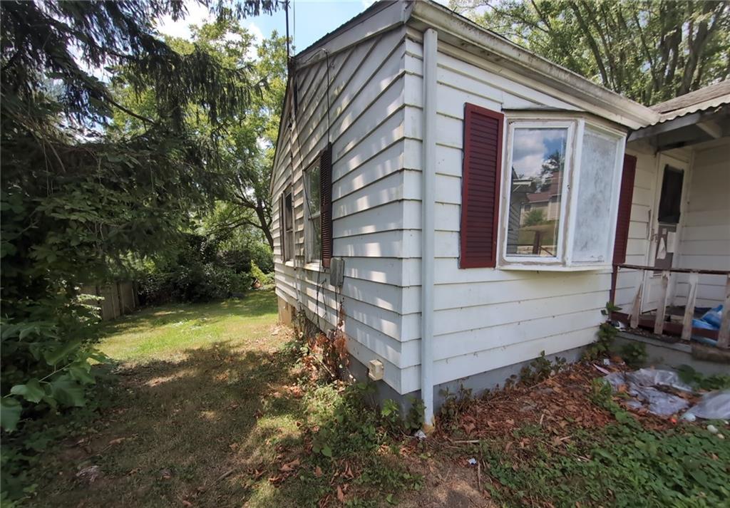 103 Maple Street Rices Landing, PA 15357 - Photo 3 of 11 a front view of a house with a yard