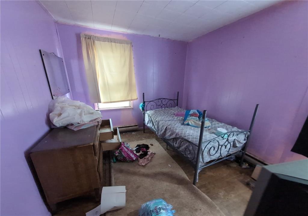 103 Maple Street Rices Landing, PA 15357 - Photo 8 of 11 a bedroom with a bed and a window