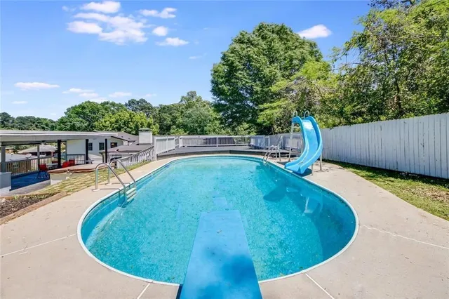 a view of a swimming pool with a patio