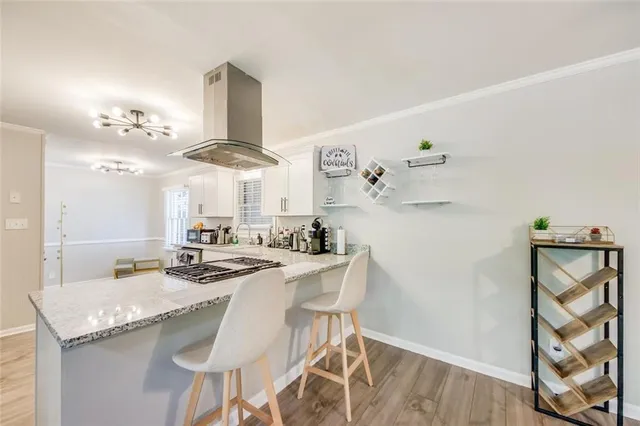 a kitchen with stainless steel appliances granite countertop a sink and a refrigerator