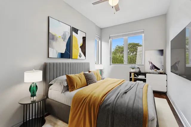 a bedroom with bed and window