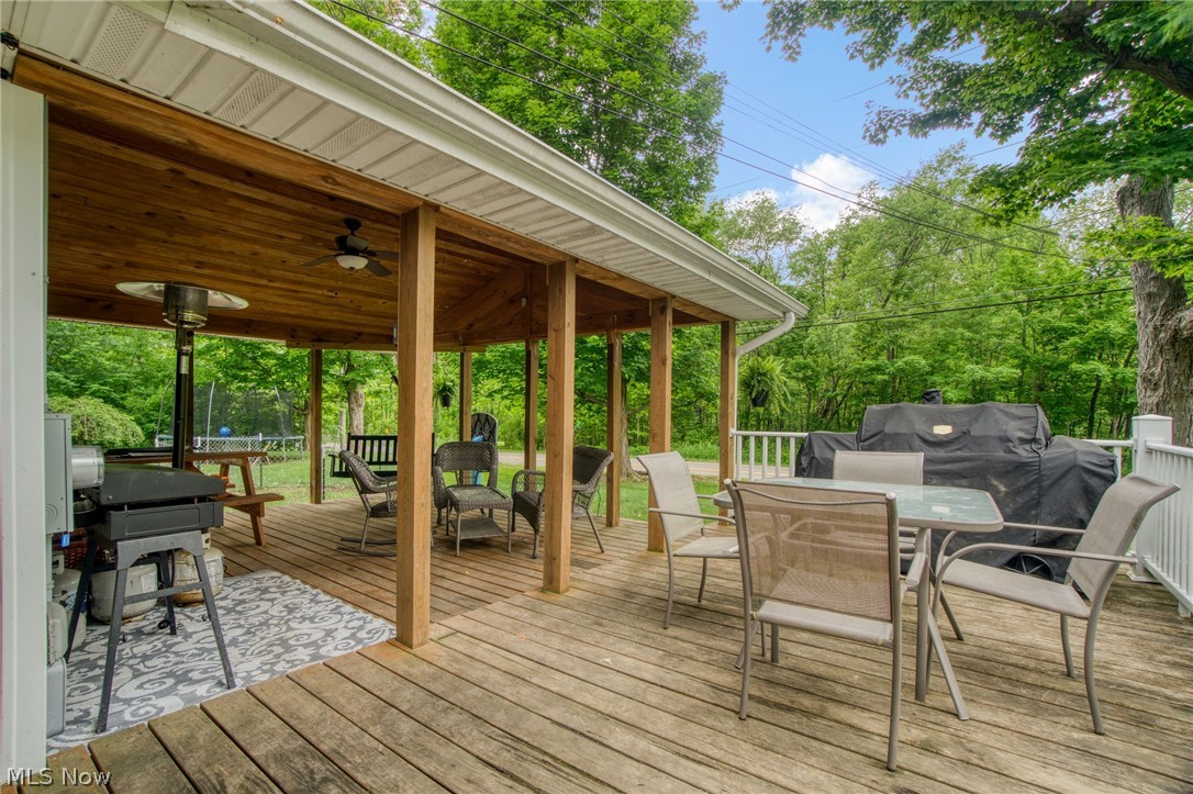 15221 Thompson Road Thompson, OH 44086 - Photo 27 of 31 Wooden deck featuring ceiling fan