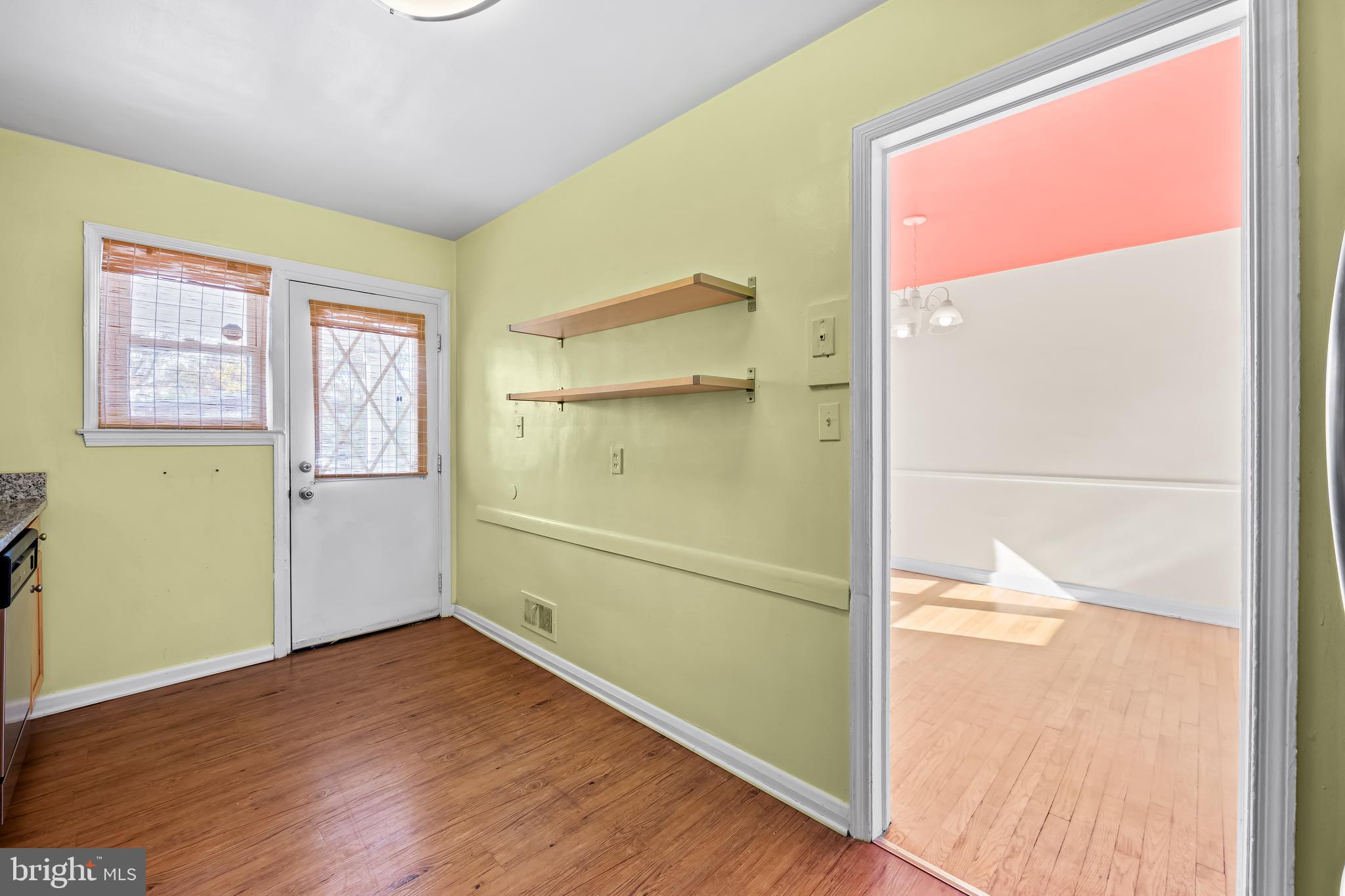 1027 Evesham Avenue Baltimore, MD 21212 - Photo 11 of 39 a view of empty room with wooden floor