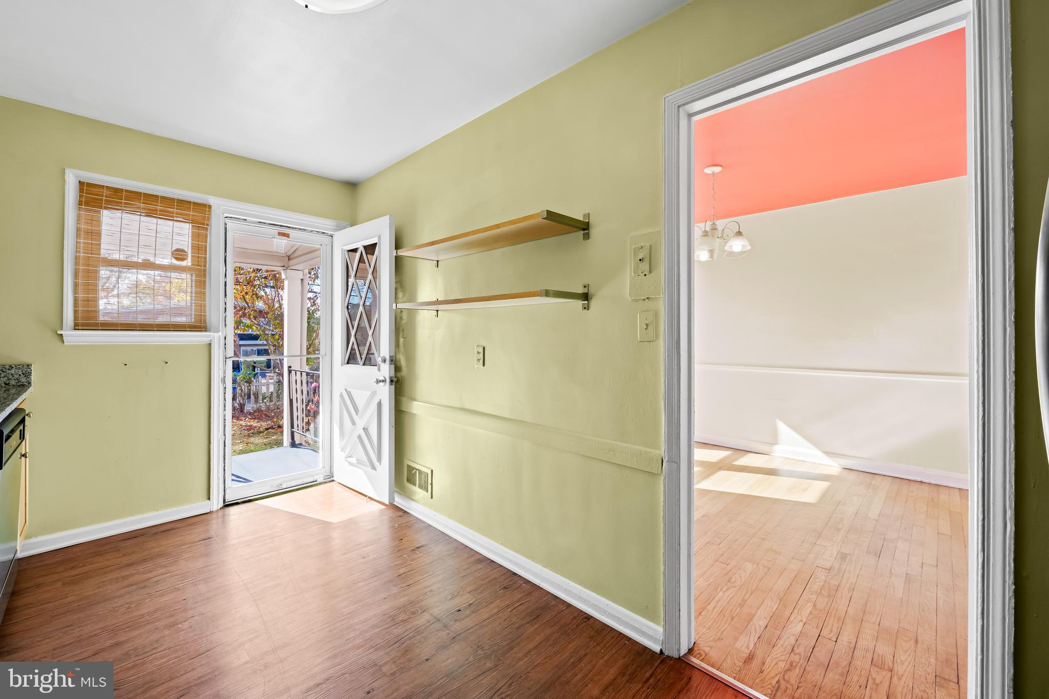 1027 Evesham Avenue Baltimore, MD 21212 - Photo 12 of 39 a view of empty room with wooden floor