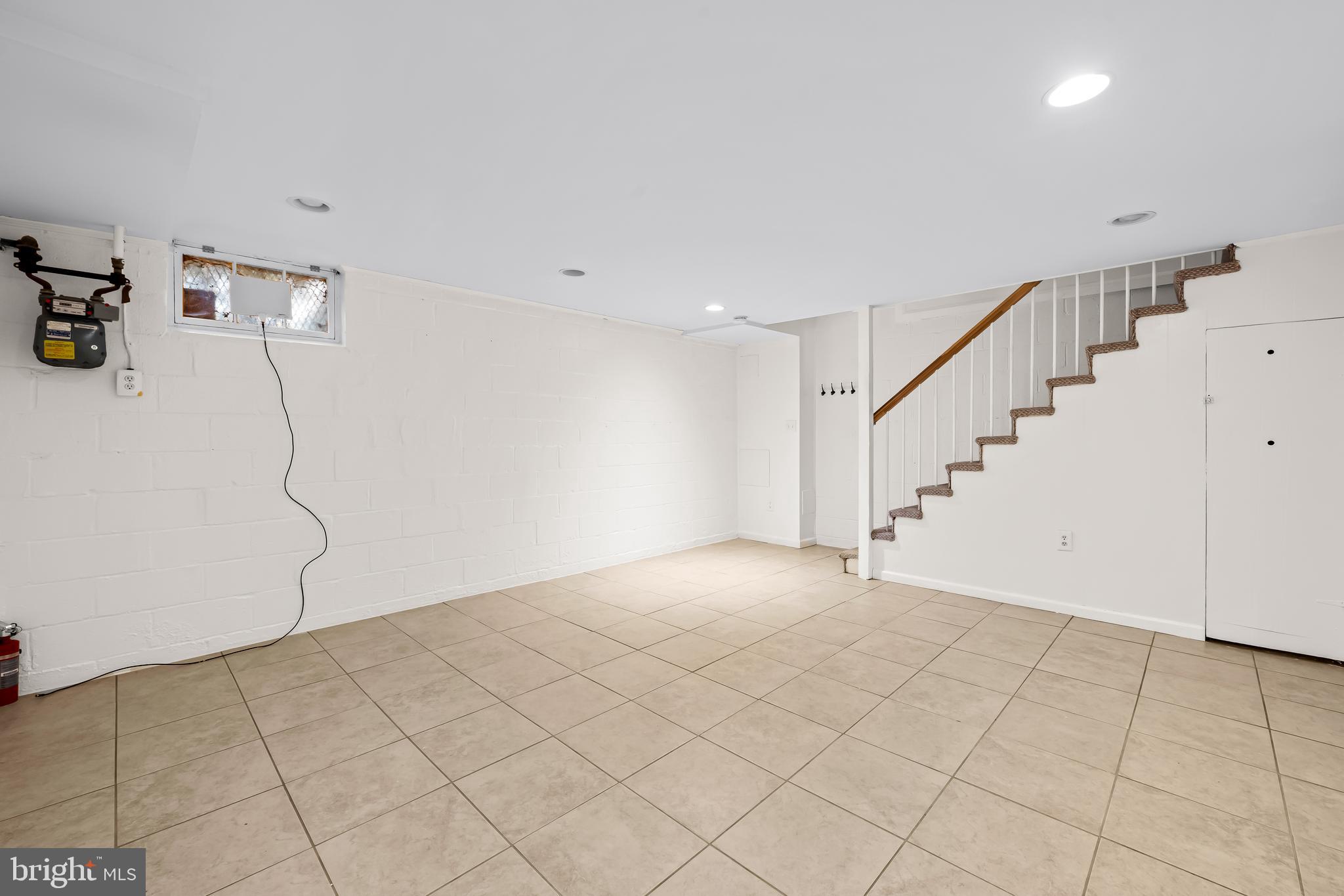1027 Evesham Avenue Baltimore, MD 21212 - Photo 16 of 39 a view of an empty room with stairs