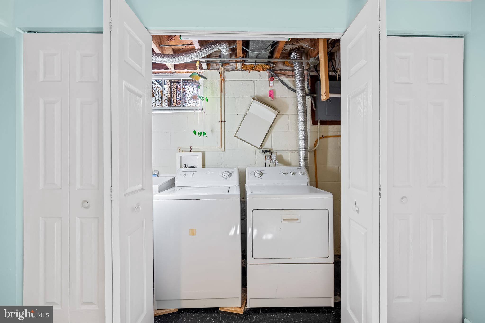 1027 Evesham Avenue Baltimore, MD 21212 - Photo 19 of 39 a utility room with dryer and washer