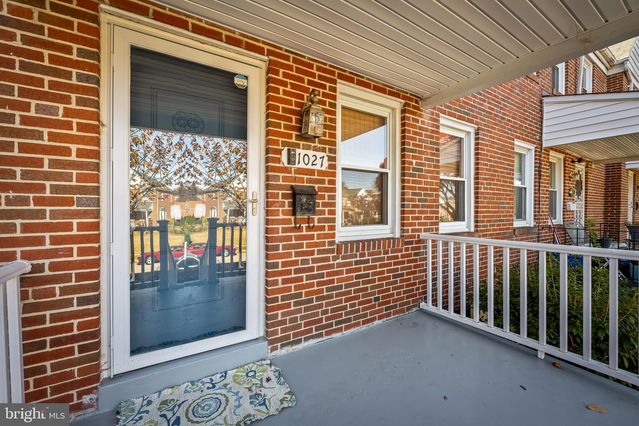 1027 Evesham Avenue Baltimore, MD 21212 - Photo 3 of 39 a view of a balcony with a door