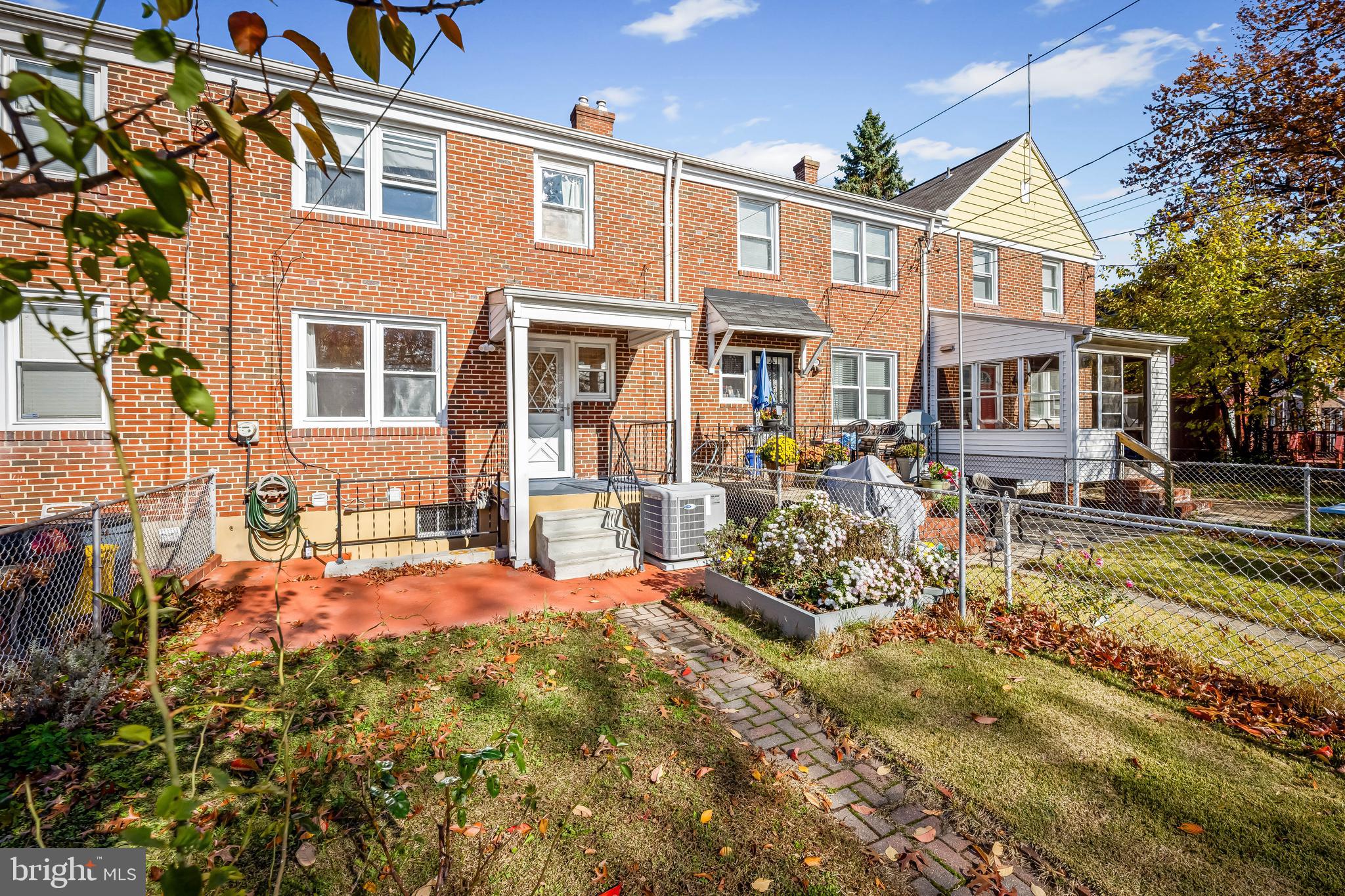 1027 Evesham Avenue Baltimore, MD 21212 - Photo 33 of 39 a front view of a building with garden