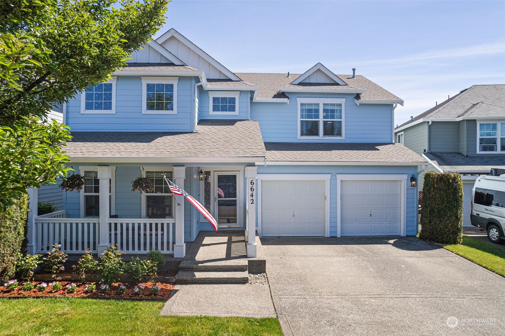 6642 Compass Street Southeast Lacey, WA 98513 - Photo 1 of 40 a front view of a house with a yard and garage