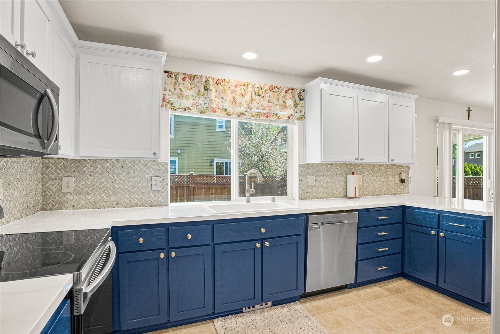 6642 Compass Street Southeast Lacey, WA 98513 - Photo 11 of 40 a kitchen with a sink and wooden cabinets