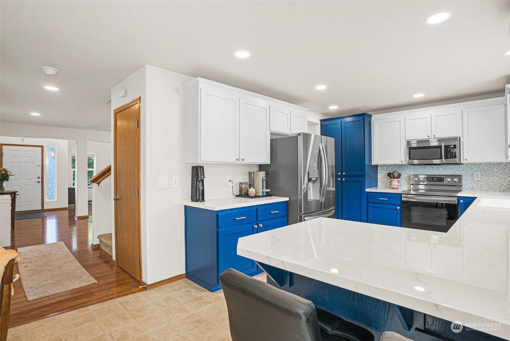 6642 Compass Street Southeast Lacey, WA 98513 - Photo 15 of 40 a kitchen with stainless steel appliances a refrigerator sink and microwave