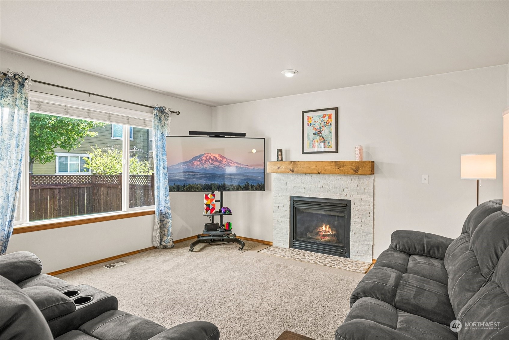 6642 Compass Street Southeast Lacey, WA 98513 - Photo 18 of 40 a living room with furniture window and a fireplace