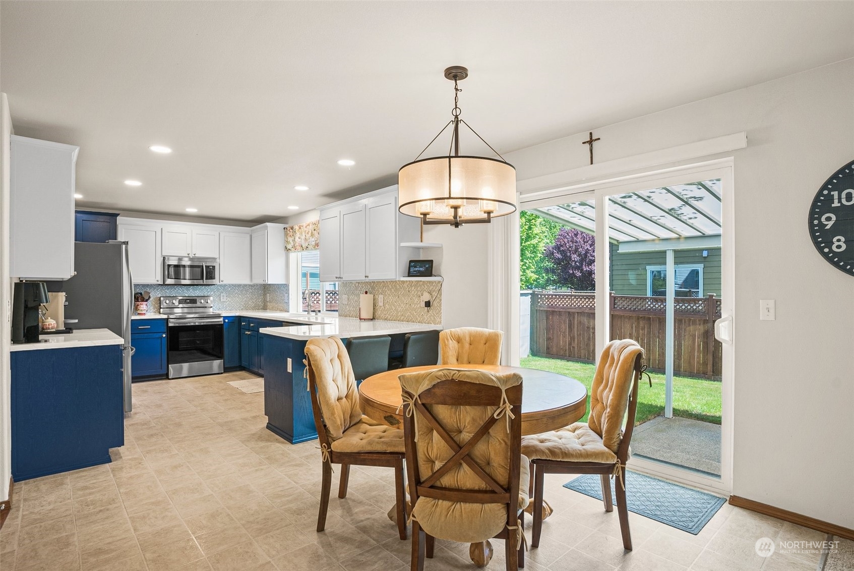 6642 Compass Street Southeast Lacey, WA 98513 - Photo 20 of 40 a view of a dining room with furniture wooden floor and chandelier