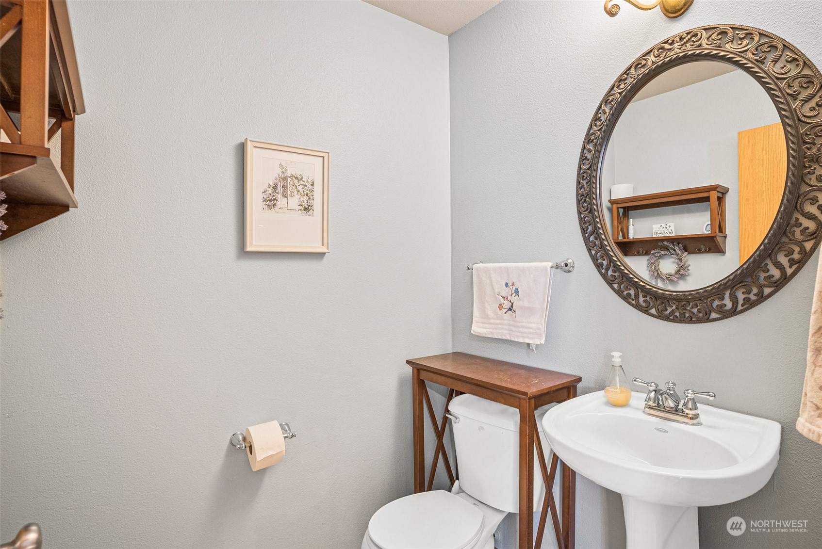 6642 Compass Street Southeast Lacey, WA 98513 - Photo 21 of 40 a bathroom with a toilet sink and mirror