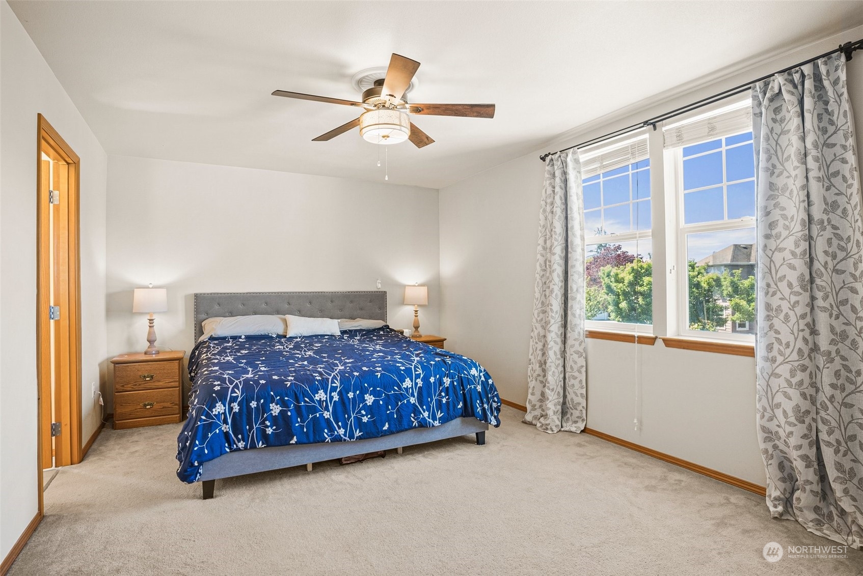 6642 Compass Street Southeast Lacey, WA 98513 - Photo 24 of 40 a bedroom with a bed and a chandelier