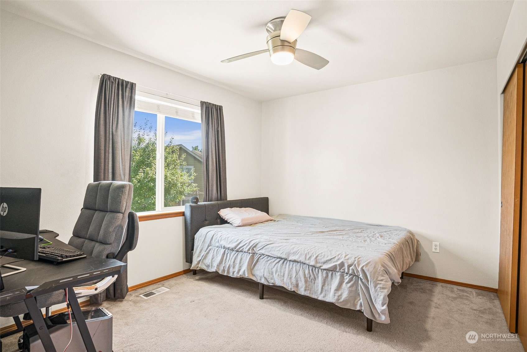 6642 Compass Street Southeast Lacey, WA 98513 - Photo 29 of 40 a bedroom with a bed and a desk