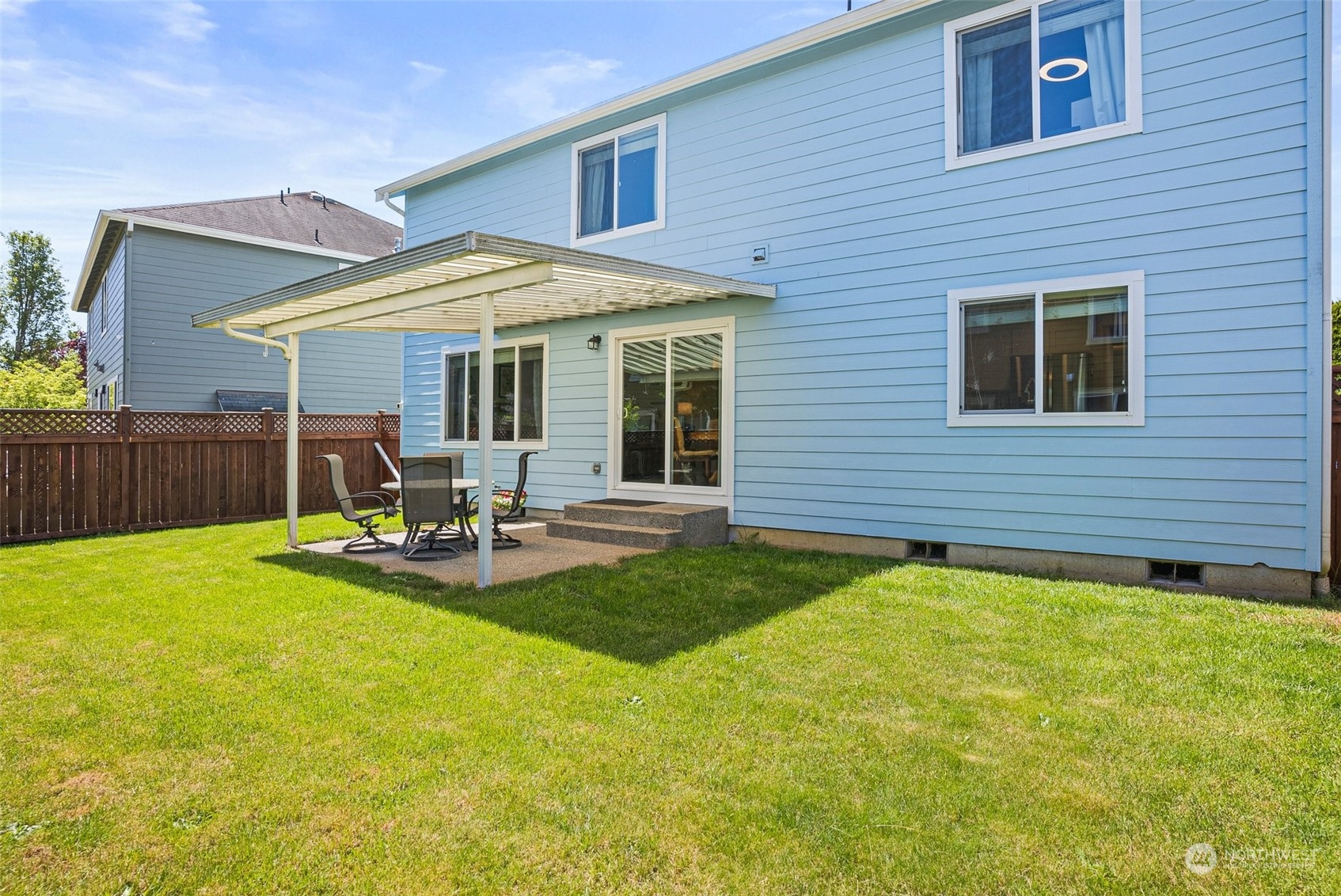6642 Compass Street Southeast Lacey, WA 98513 - Photo 34 of 40 a view of a house with a backyard and a patio